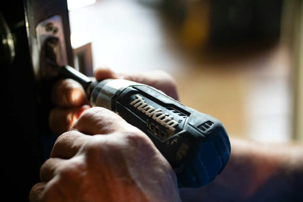 A locksmith changing a residential lock